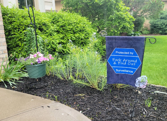Home is protected by fuck around and find out garden flag