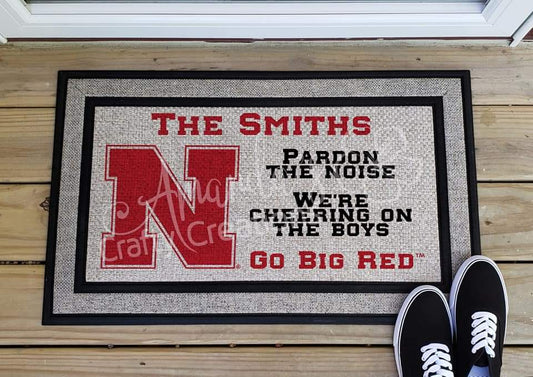 Customizable pardon the noise we're cheering on the boys go big red Nebraska Husker door mat